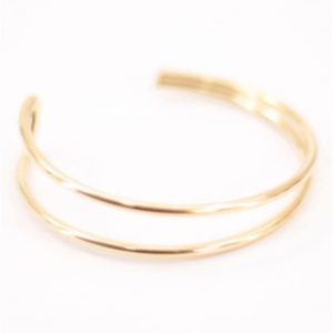 Brazalete mujer acero dorado asimétrico