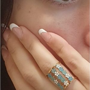 Anillo mujer acero dorado margaritas